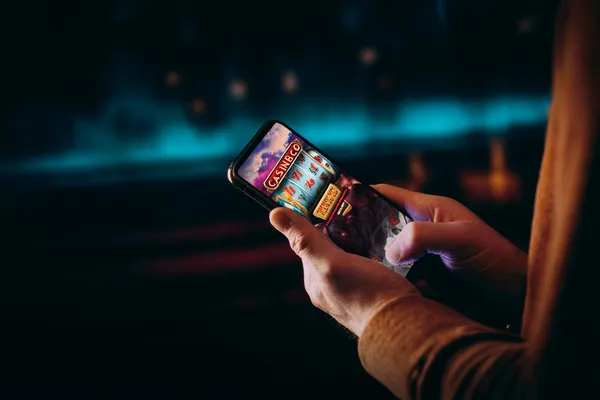 A close-up shot of golden coins falling around a spinning roulette wheel, representing immersive casino action at 2J777.