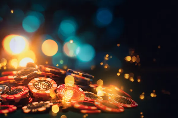 A confident dealer surrounded by casino chips inviting players to access their 2J777 account, reflecting quick and easy login options.